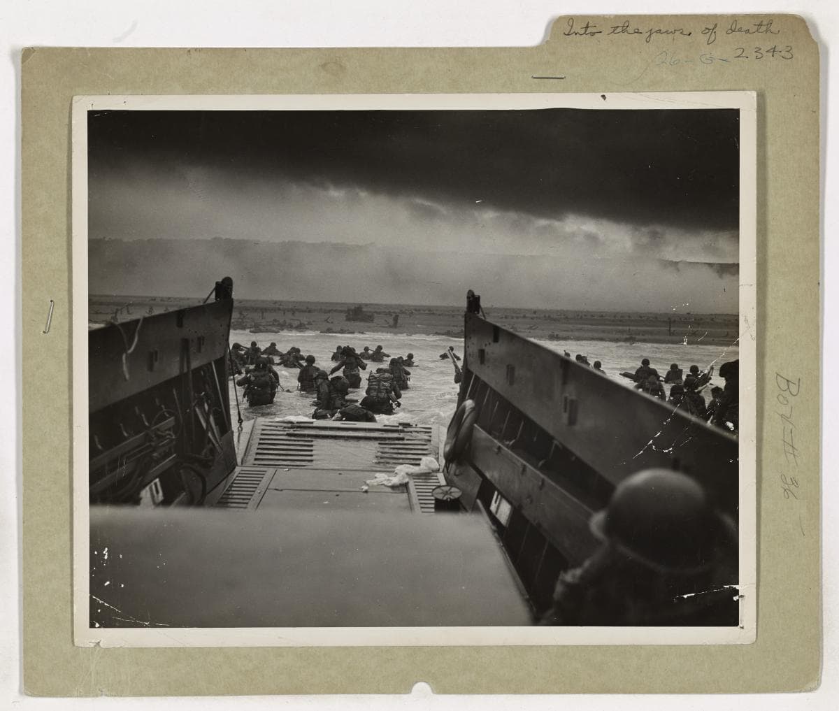 Soldiers of the 1st Infantry Division wading ashore under fire at Omaha Beach, D-Day, June 6, 1944