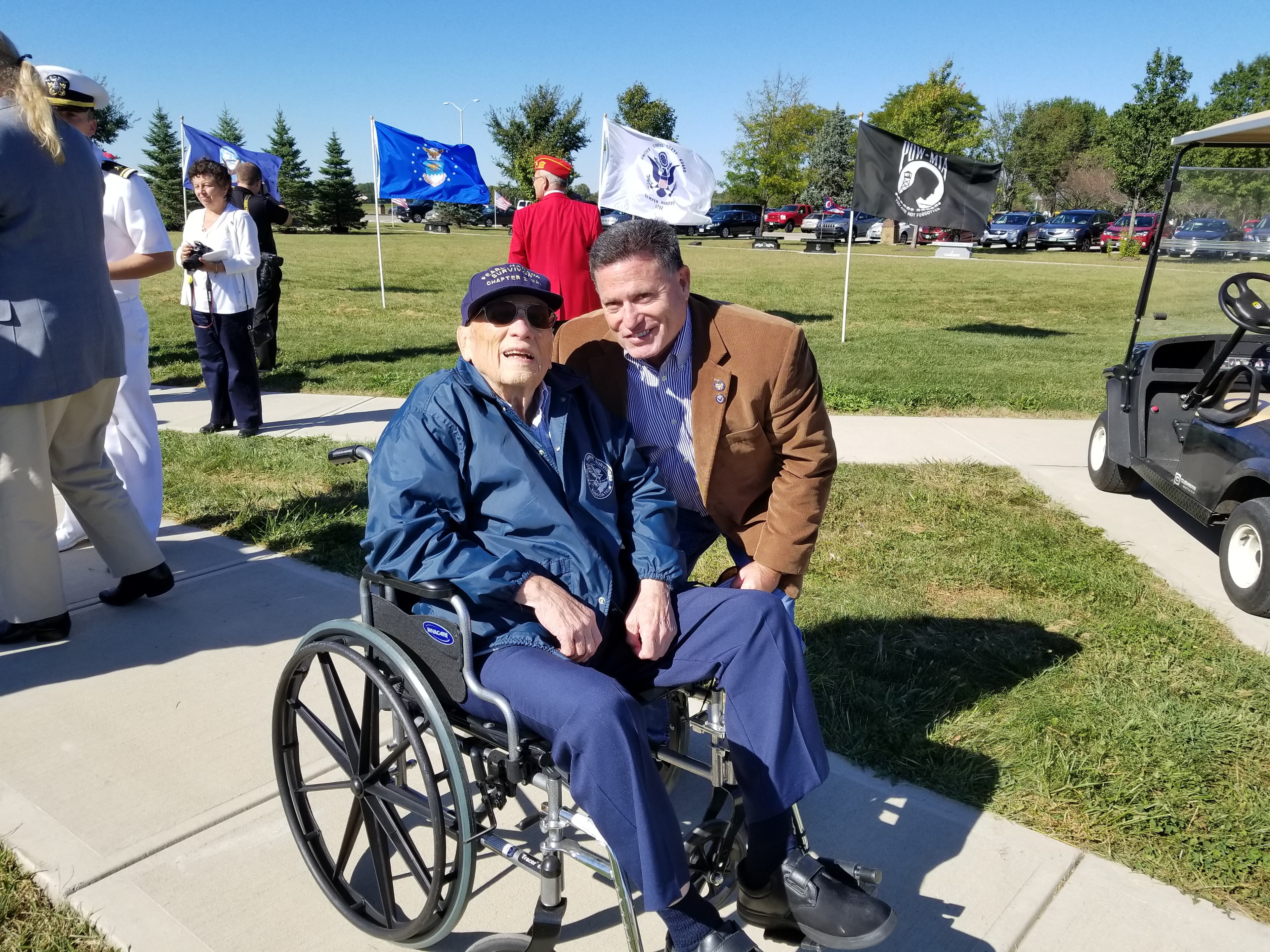 Rick Perales with an elderly veteran at an outdoor flag ceremony — the people Pitbull 214 was built to serve